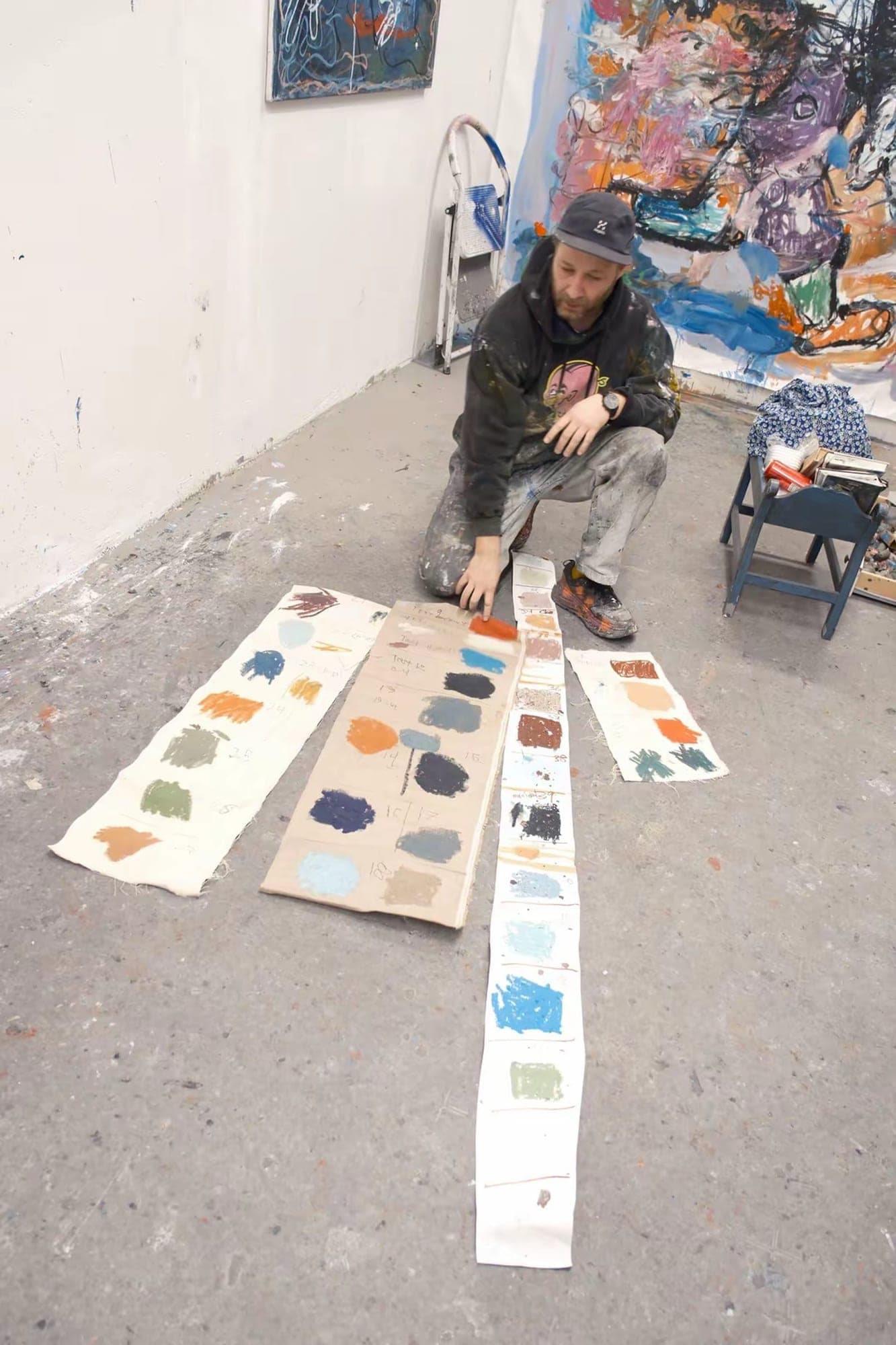 Paintings in progress on the studio wall