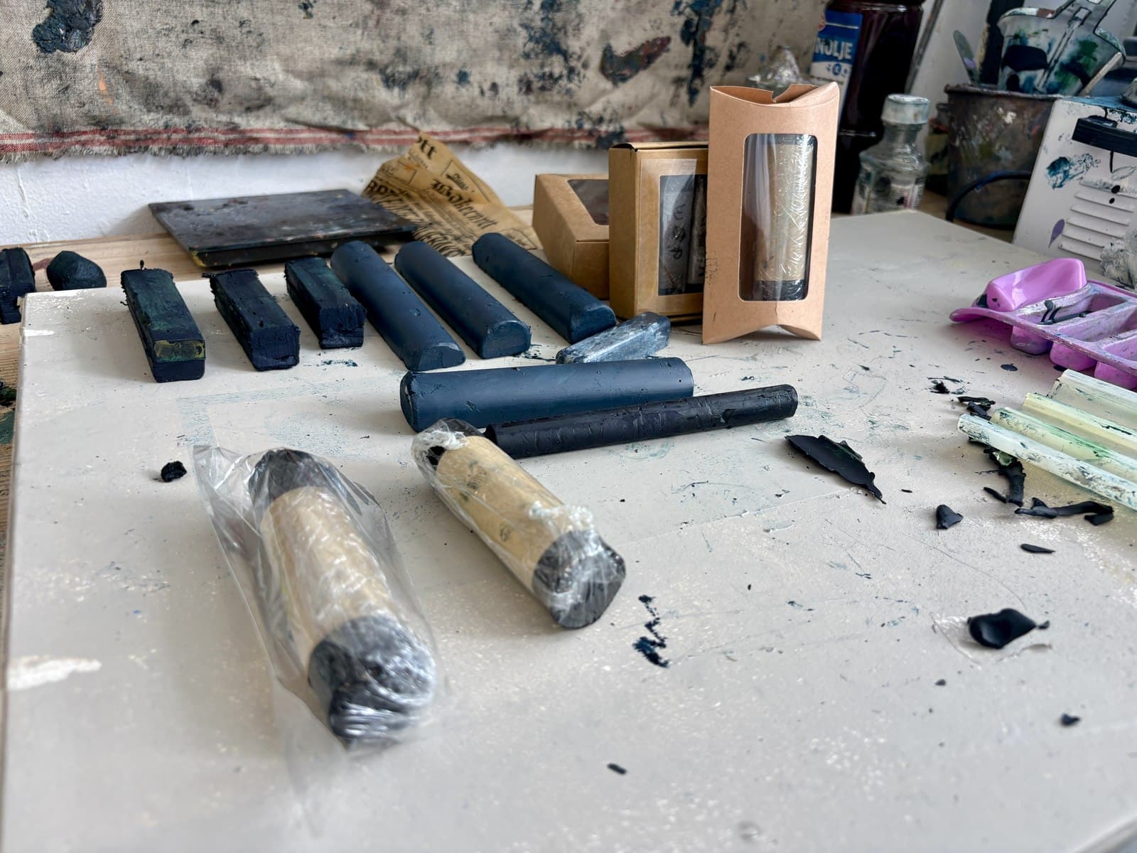 Handmade oil bars made with the Wax & Pigment app, laid out on a studio table